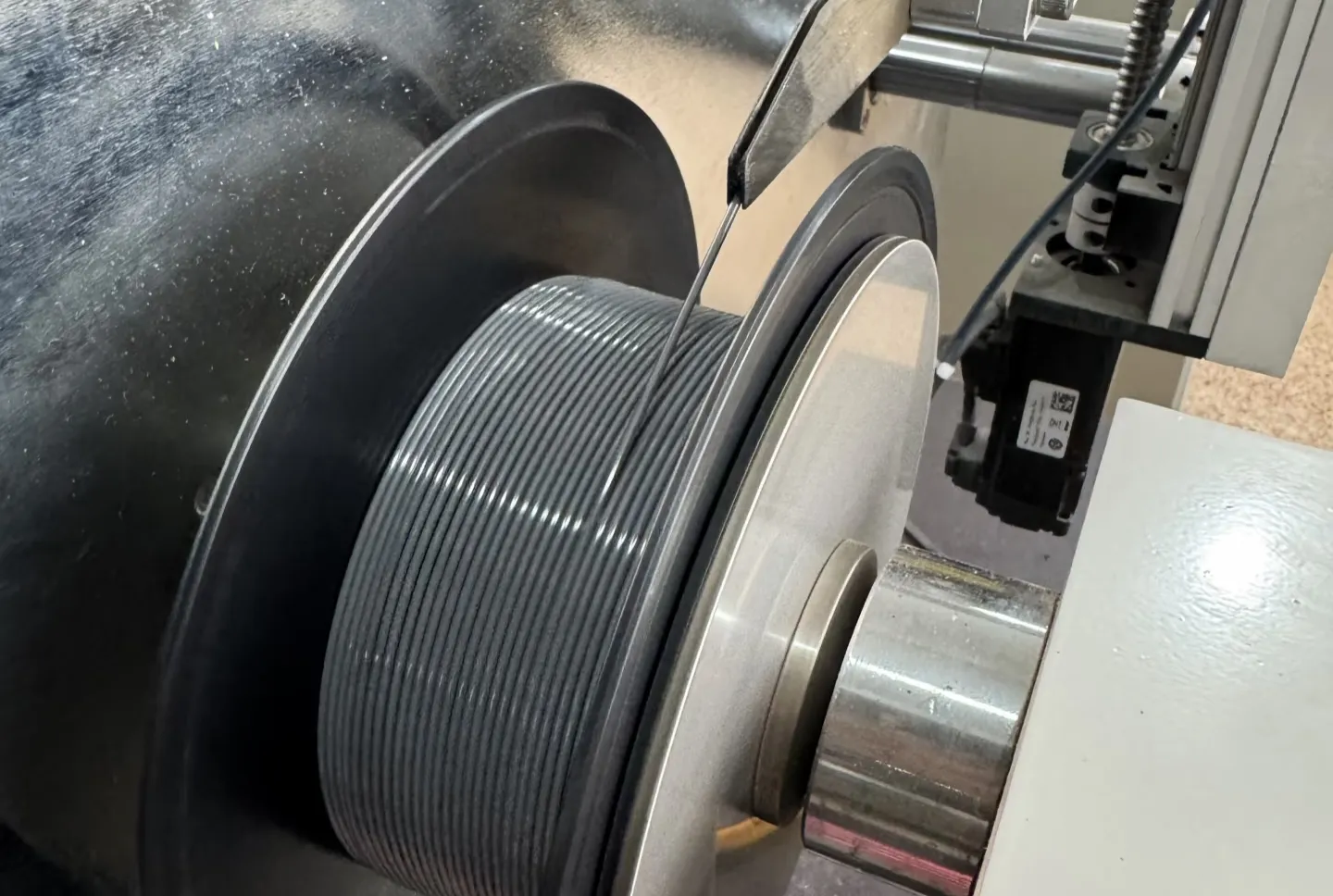 Filament winding and diameter control during OEM 3D printer filament manufacturing